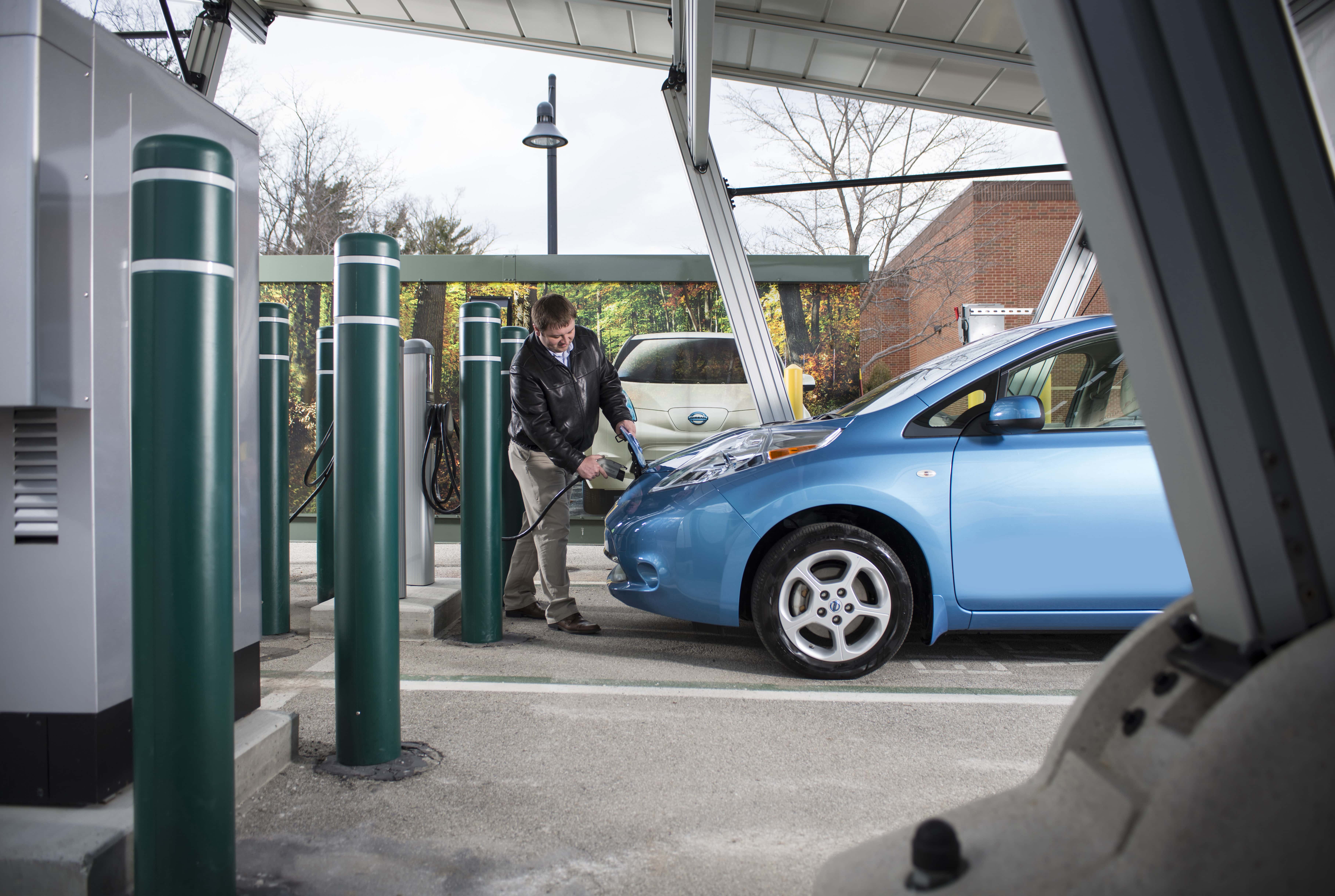 Plugin electric vehicle charging station, solar panels and battery storage at Clay Terrace shopping center. Carmel, Indiana; PEV; Nissan Leaf; Josh Snodgrass (272377)