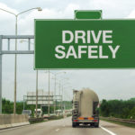 Fuel Tanker Truck and Drive Safely Sign